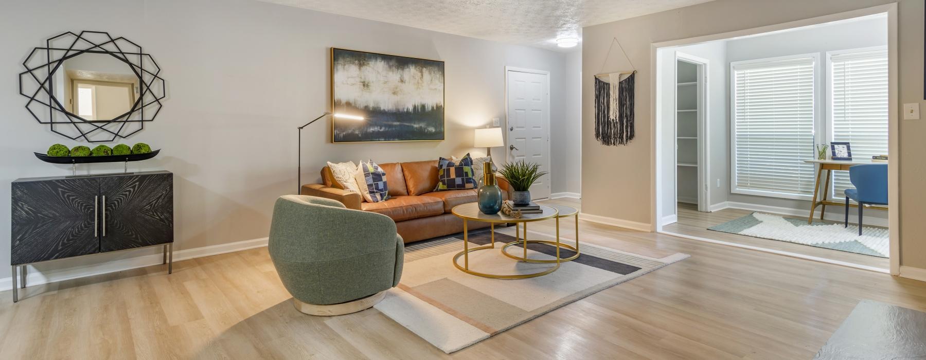 a living room with a couch and a chair