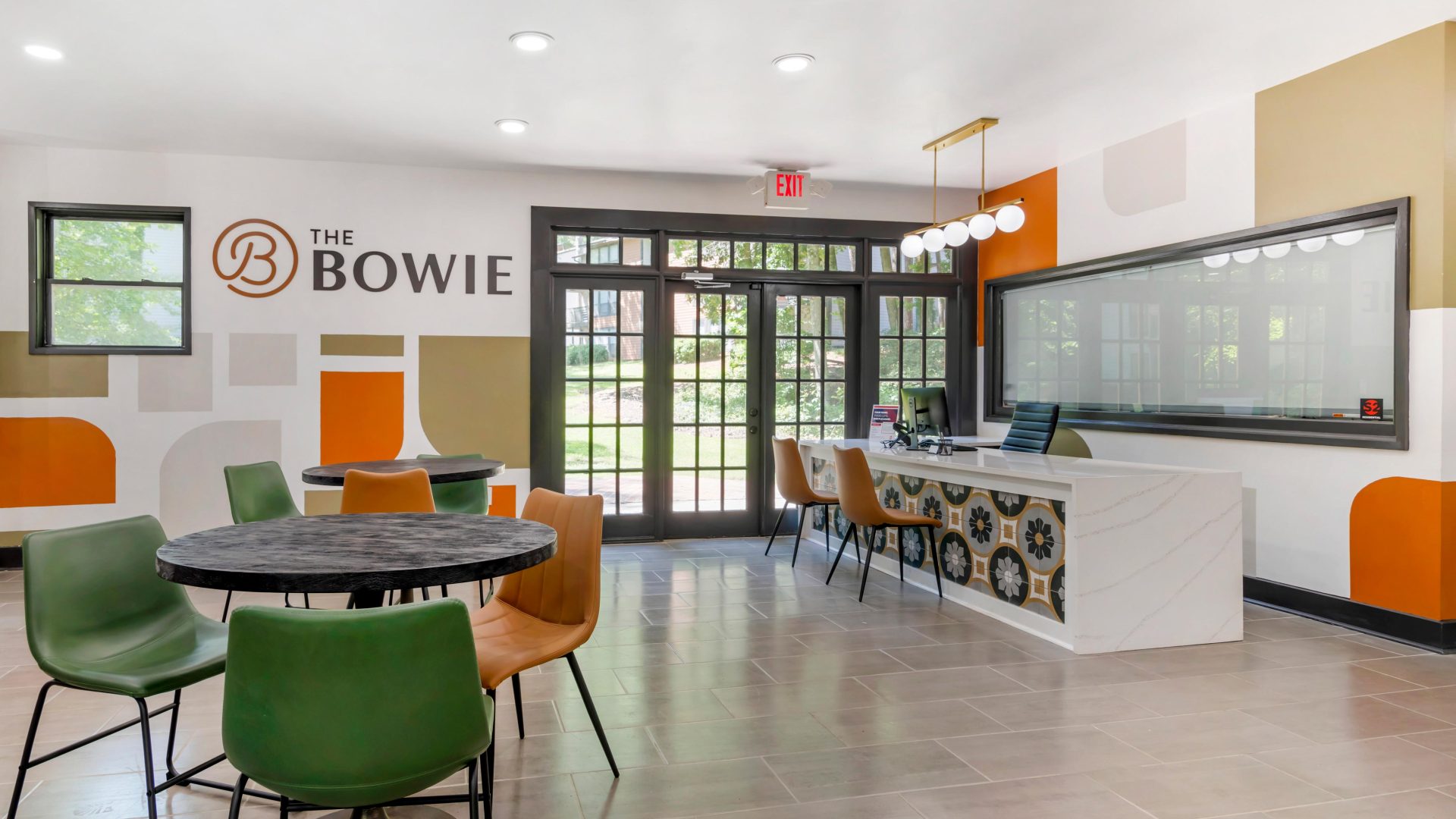 the bowie office features a large table and chairs at The  Bowie