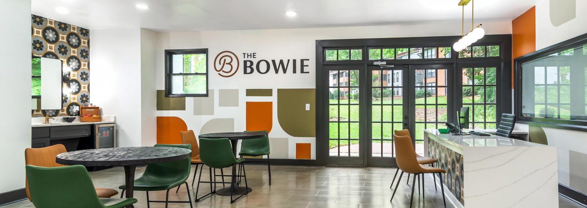 a modern office with orange and green walls at The  Bowie