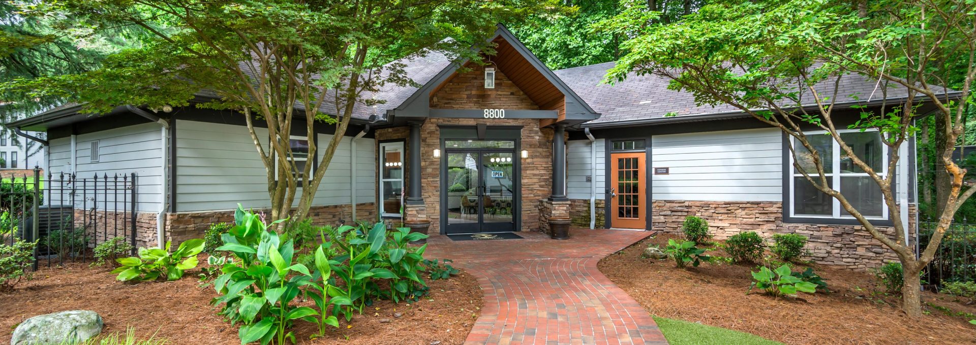 a brick home with a driveway and walkway at The  Bowie