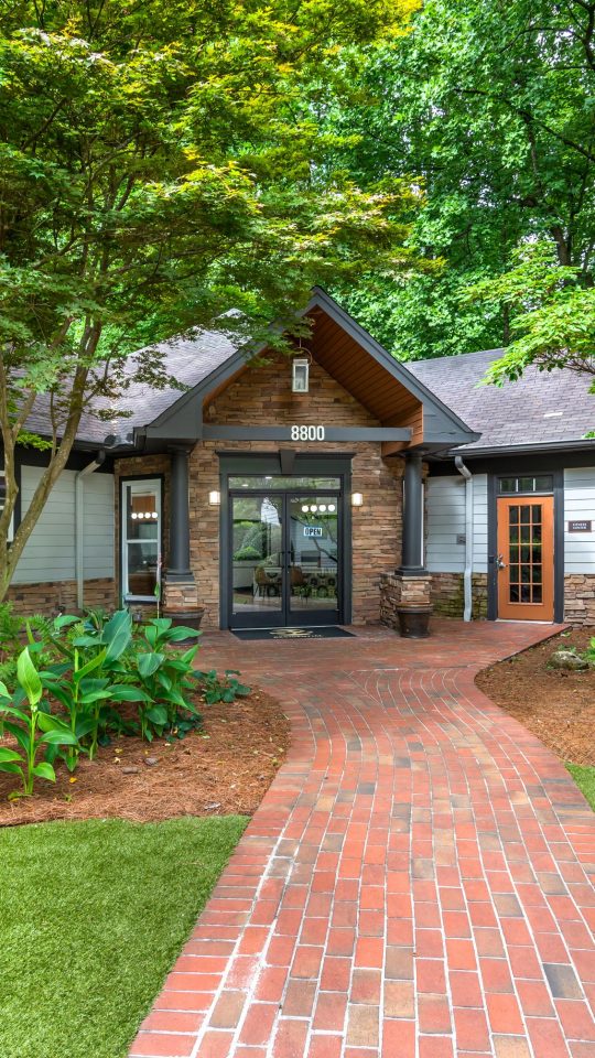 a brick home with a driveway and walkway at The  Bowie